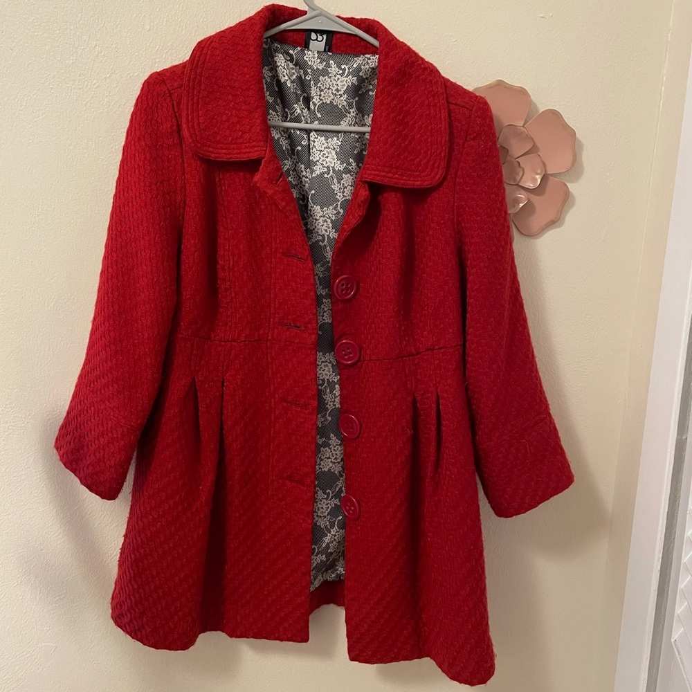 Red Christmas coat.